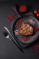 Delicious juicy pork or beef steak grilled with salt, spices and herbs