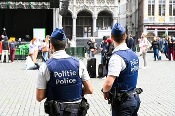 Gordijnen Police patrolling on main square in Brussels. Belgian police officers on the street. Grand Place. © Ajdin Kamber