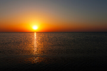 Amazing sunsrise over the sea, beautiful sunrise, 
reflections of the sun's rays in the sea