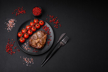 Delicious juicy pork or beef steak grilled with salt, spices and herbs