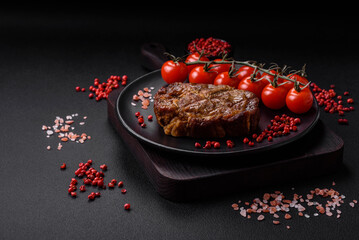 Delicious juicy pork or beef steak grilled with salt, spices and herbs