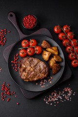 Delicious juicy pork or beef steak grilled with salt, spices and herbs