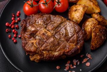 Delicious juicy pork or beef steak grilled with salt, spices and herbs