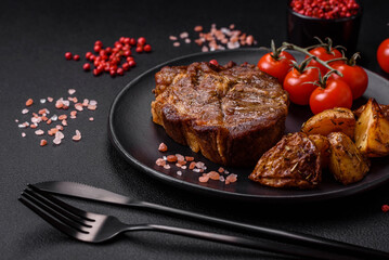 Delicious juicy pork or beef steak grilled with salt, spices and herbs