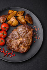 Delicious juicy pork or beef steak grilled with salt, spices and herbs