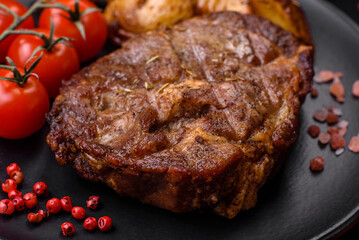 Delicious juicy pork or beef steak grilled with salt, spices and herbs