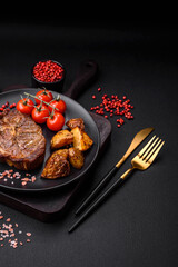 Delicious juicy pork or beef steak grilled with salt, spices and herbs