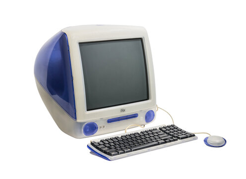 Los Angeles, California, USA - May 29, 2023:  Illustrative editorial photograph of vintage 1999 Apple iMac G3 desktop computer, keyboard and mouse.  Isolated with cut out background.