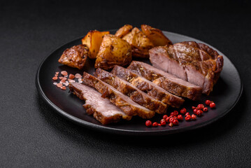 Delicious juicy pork or beef steak grilled with salt, spices and herbs
