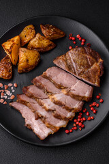 Delicious juicy pork or beef steak grilled with salt, spices and herbs