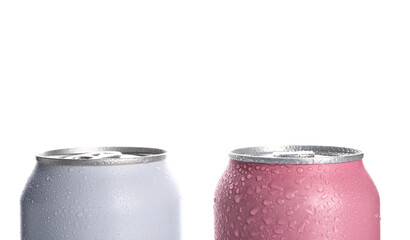 Cans of fresh soda with water drops isolated on white background, closeup