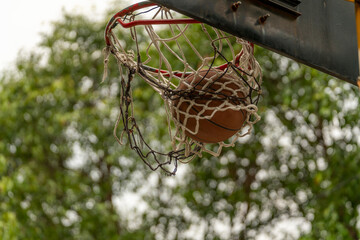 Fototapeta na wymiar Condensation of time the basketball falls into the basket