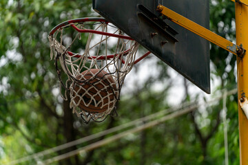 Fototapeta na wymiar Condensation of time the basketball falls into the basket