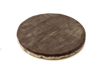 One dark chocolate covered rice cake snack isolated on white background
