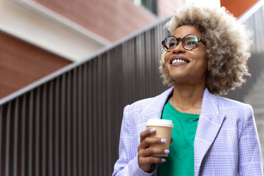 Motivated dreamy professional woman. Inspirational look of a young creative smart trendy woman in her 30s.