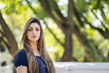 Thoughtful blond young woman with a lost look