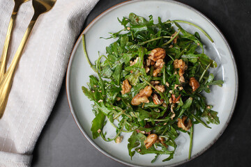 healthy eating diet. Arugula salad with olive oil and pecan.