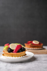 fruit tart dessert with white chocolate and cream.