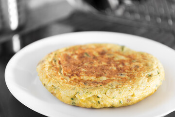 Vegetable omelette with peppers, green asparagus and mushrooms