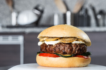 Meat burger with tomato, zucchini, mushrooms and mozzarella cheese, in mollette bread