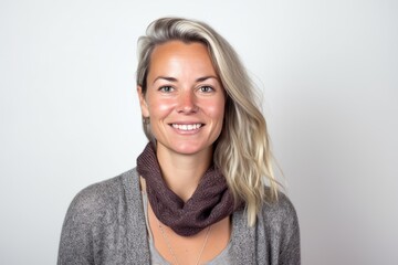 Fototapeta premium Portrait of a beautiful young woman with short blond hair and a scarf