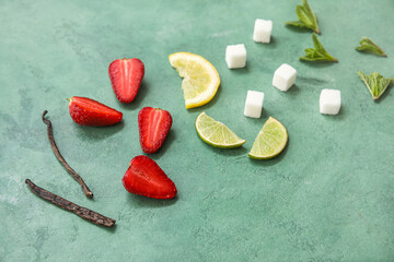 Ingredients for preparing strawberry compote on green background