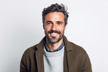 Obraz premium Portrait of a handsome man smiling at the camera on a white background
