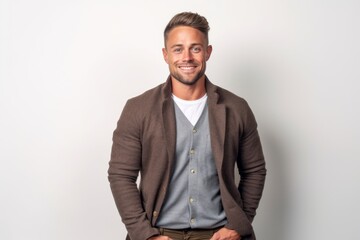 Portrait of a handsome young man in casual clothes on white background