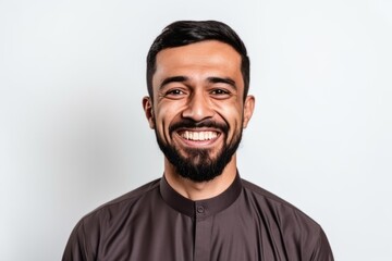 Fototapeta premium Portrait of a happy young man smiling isolated on a white background