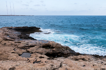 rocky coast of Cyprus. Storm on the sea, waves