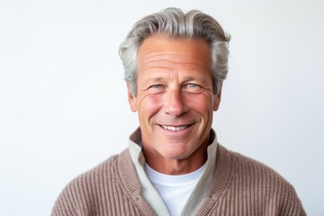 Obraz premium Portrait of smiling senior man on white background. Looking at camera.