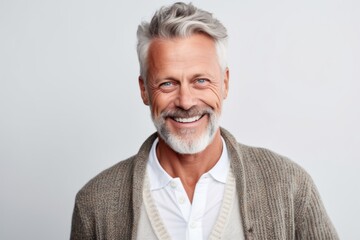Portrait of a smiling senior man looking at camera isolated on a white background