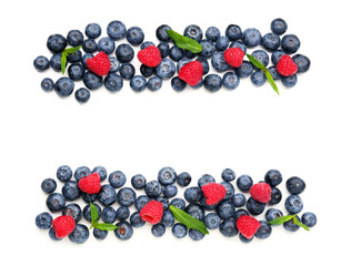 Ripe raspberry and blueberry on white background