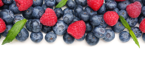 Ripe raspberry and blueberry on white background, closeup