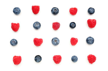 Ripe raspberry and blueberry on white background