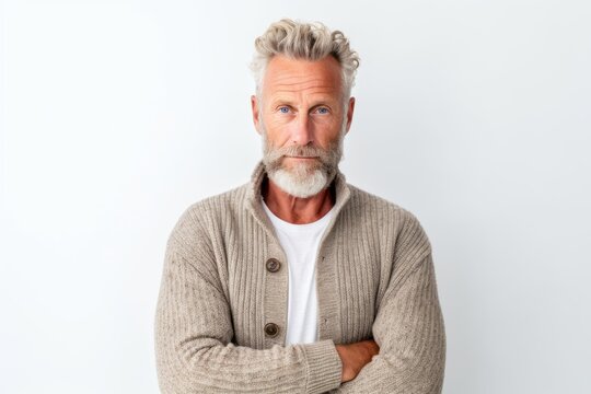 Portrait of senior man with grey hair and beard on white background