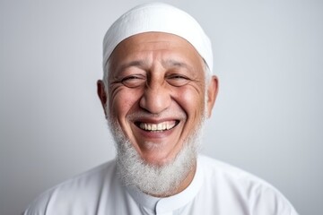 Portrait of a smiling muslim man in a white t-shirt