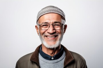 Portrait of a happy senior man with glasses on a white background