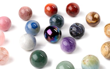 Polished colored marbles arranged in a spiral pattern.