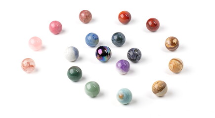 Polished colored marbles arranged in a spiral pattern.