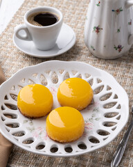 Quindim, traditional egg and coconut brazilian dessert with coffee