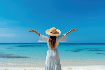 Fototapeta na wymiar Beautiful woman rise hand up to sky feel relax and freedom on summer beach background.