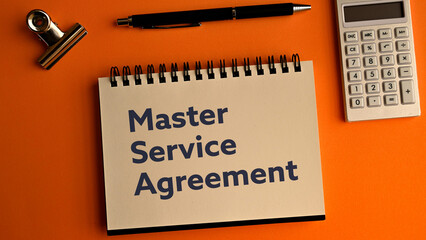 There is notebook with the word Master Service Agreement. It is as an eye-catching image.
