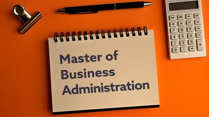 There is notebook with the word Master of Business Administration. It is as an eye-catching image.