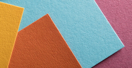 colored paper in layers for banner background.multicolored paper with texture close-up for background.