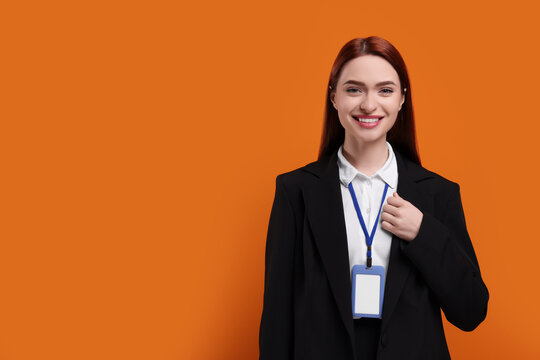 Happy woman with vip pass badge on orange background. Space for text