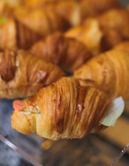 Catering table, beautifully decorated banquet with variety of with different food snacks appetizers on corporate birthday party event or wedding celebration, canape, salad, delicatessen setting