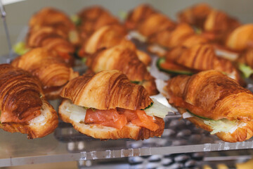 Catering table, beautifully decorated banquet with variety of with different food snacks appetizers on corporate birthday party event or wedding celebration, canape, salad, delicatessen setting