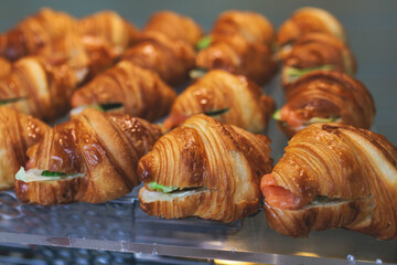 Catering table, beautifully decorated banquet with variety of with different food snacks appetizers on corporate birthday party event or wedding celebration, canape, salad, delicatessen setting