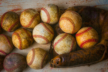 Worn Mitt And Baseballs
